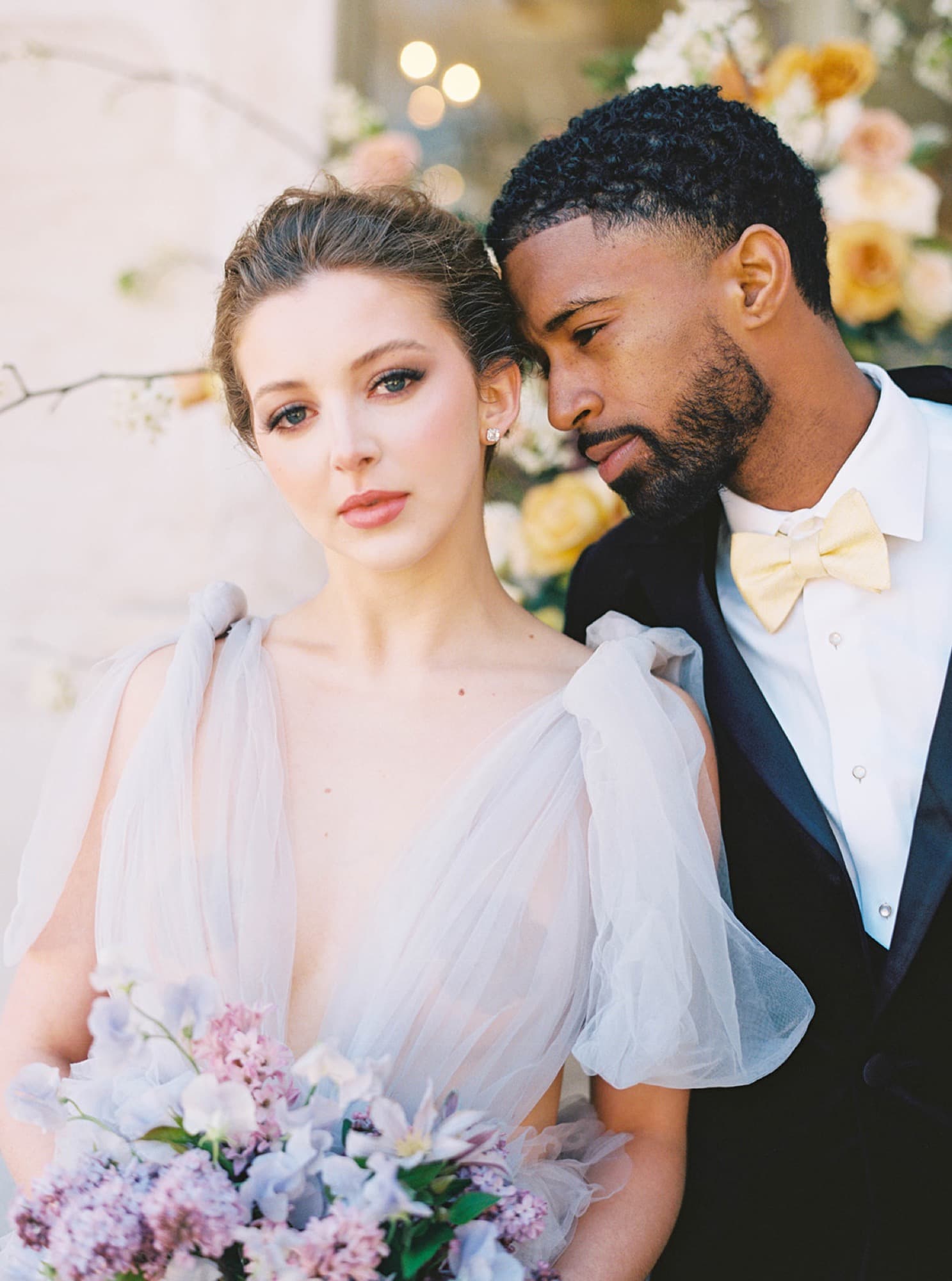 Abyon Ausar close with a bride in a lilac gown