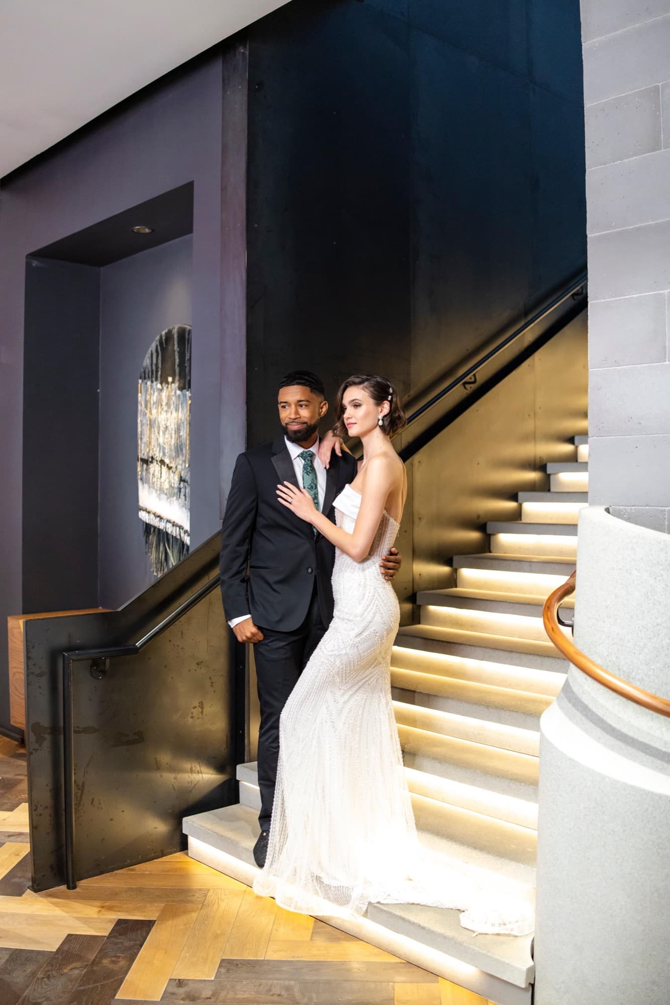 Abyon Ausar with a bride in a warm hotel interior