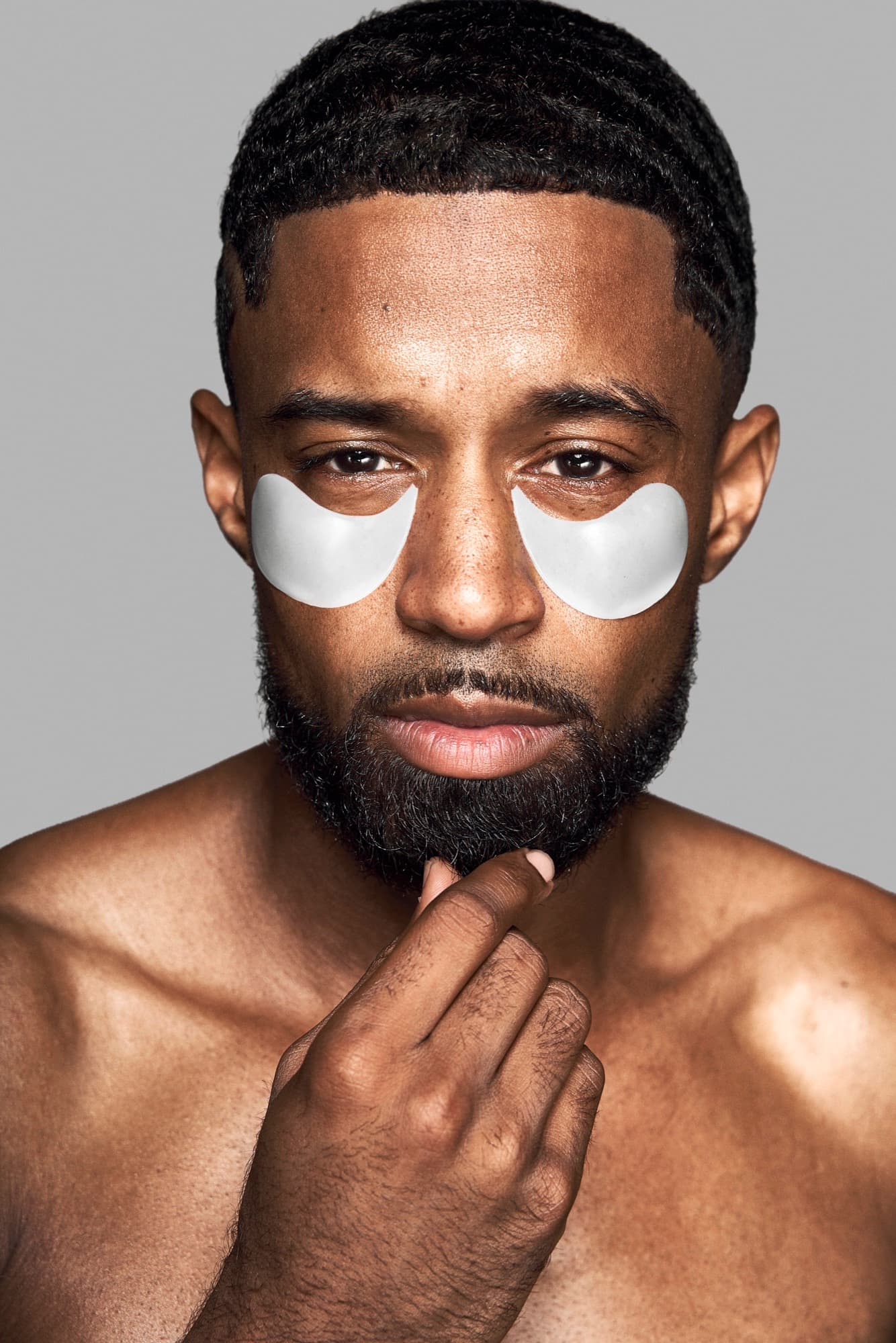 Abyon Ausar wearing under-eye patches, grooming campaign styling